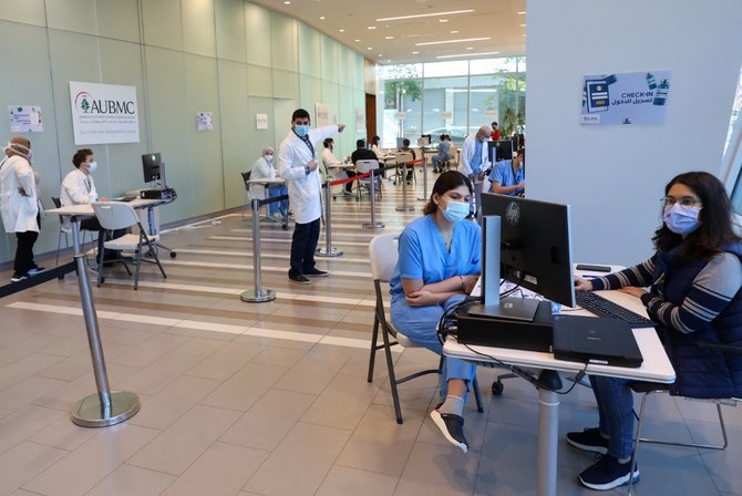 People arrive to receive the COVID-19 Pfizer/BioNTech vaccine at Lebanon's American University of Beirut Medical Center. (File/AFP)