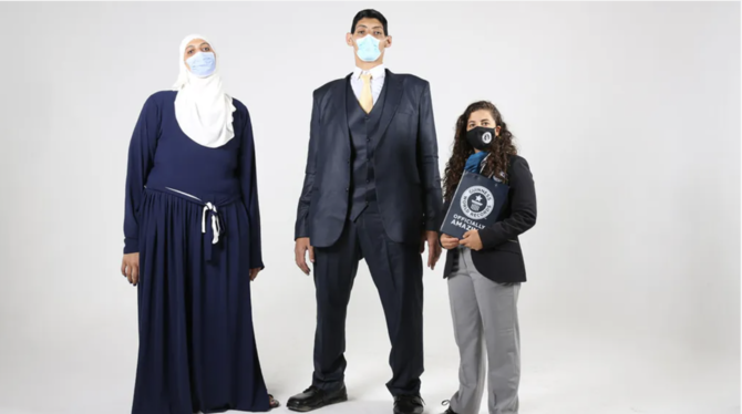 Mohammed Abdel-Gawad, 33, got two Guinness World Records: the widest arms of a living man at 250.3 cm, and the widest hand of a surviving man at a length of 31.3 cm. (Guinness World Records)