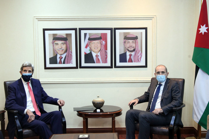 Jordan’s Foreign Minister Ayman Safadi meets with US special envoy for climate John Kerry in the capital, Amman, on Dec. 5, 2021. (Petra)