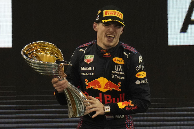 Red Bull driver Max Verstappen of the Netherlands celebrates after he became the world champion after winning the Formula One Abu Dhabi Grand Prix. (AP)