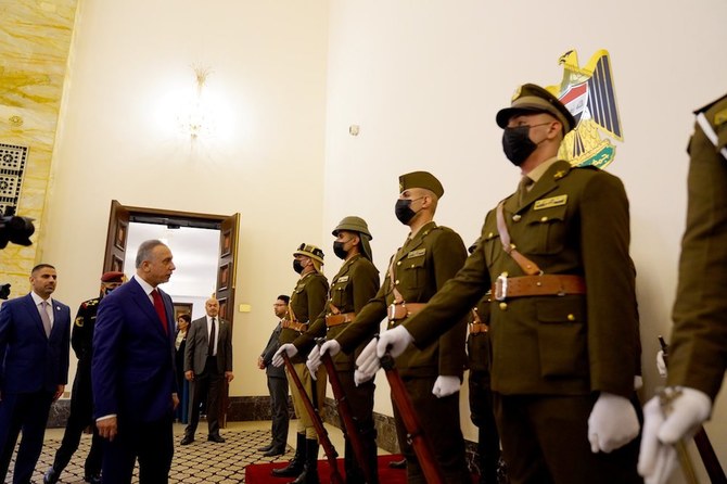 Iraq’s Prime Minister Mustafa Al-Kadhimi meets service personnel at a ceremony marking the centenary of the founding of the modern Iraqi state. (Supplied)