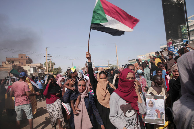 People protest on Monday against the October military coup in Sudan and subsequent deal that reinstated Prime Minister Abdalla Hamdok in Khartoum. (AP)