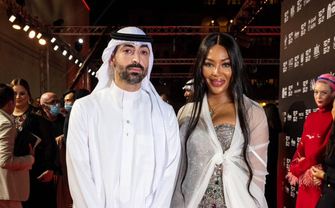 Mohammed Al-Turki, chairman of the Festival Committee, with British model Naomi Campbell. (AFP)