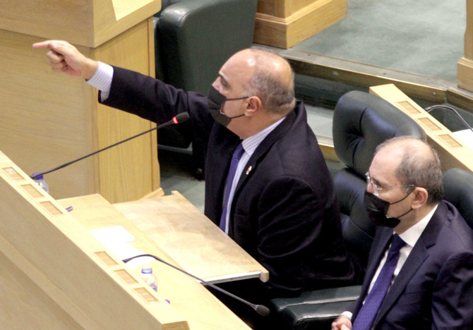 Prime Minister Bishr Khasawneh (left) responding to MPs' remarks during Wednesday's special session on the
