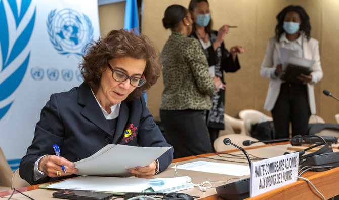 United Nations Deputy High Commissioner for Human Rights Nada Al-Nashif reads documents prior to an extraordinary meeting on Ethiopia at the United Nations (UN) Human Rights Council in Geneva on December 17, 2021. (AFP)