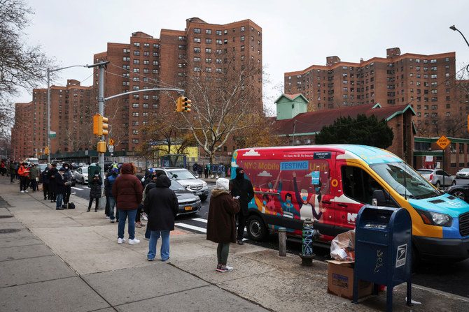 People in the Lower East Side line up on Dec. 18, 2021 at a mobile COVID-19 testing unit as the omicron coronavirus variant continues to spread in Manhattan, New York City. (REUTERS)