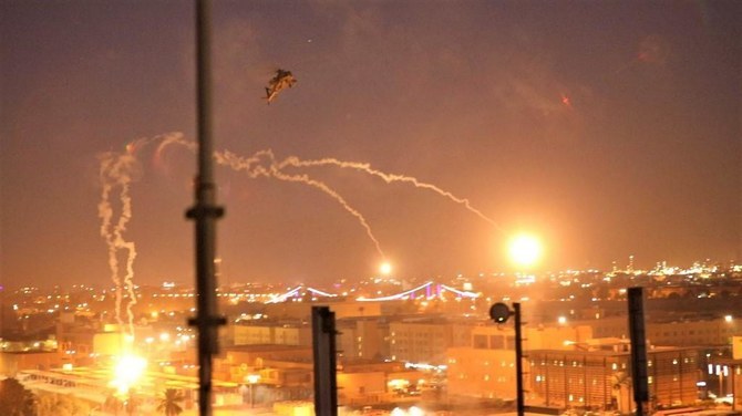 A handout picture received from the US Embassy in Iraq on December 31, 2019, shows a US army apache helicopter dropping flares over Baghdad's high-security Green Zone. (File/AFP)