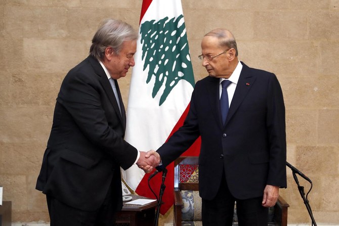 President Michel Aoun greets UN Secretary-General Antonio Guterres during a visit to the presidential palace in Baabda, east of Beirut on December 19, 2021. (AFP)