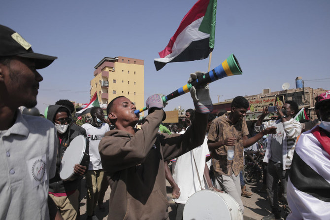 People take part in a protest against the October military takeover and a subsequent deal that reinstated Prime Minister Abdalla Hamdok but sidelined the movement in Khartoum, Sudan, Sunday, Dec. 25, 2021. (AP)