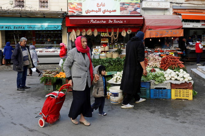 File photo of people shopping at a market in Tunis in November 2019. (Reuters)