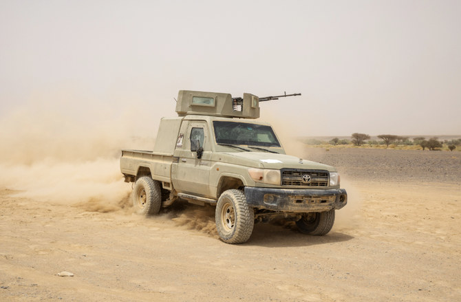 Yemeni fighters drive their armored vehicle on the Mass front line after clashes with Houthi rebels in Marib, Yemen. (AP file photo)