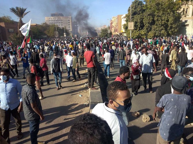 Sudanese demonstrators take to the streets of the capital Khartoum as tens of thousands protest against the army's October 25 coup, on December 30, 2021. (AFP)