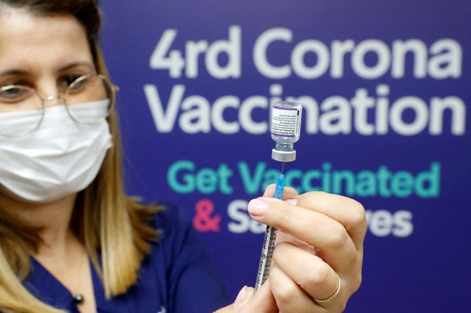 A medic prepares a dose of the Pfizer-BioNTech vaccine against the coronavirus, to be used as a fourth shot. (AFP)