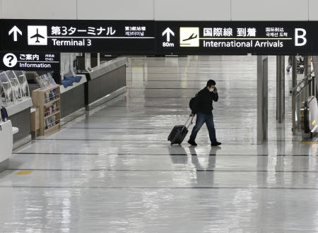 An international arrivals lobby is deserted at Narita International Airport in Narita, east of Tokyo, Japan, Monday, Nov. 29, 2021. (AP)