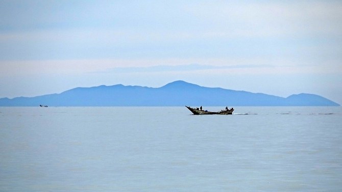 Fishermen sail near Zuqar Island off the coast of Yemen's war-ravaged Red Sea port city of Hodeida on May 3, 2021. (AFP)