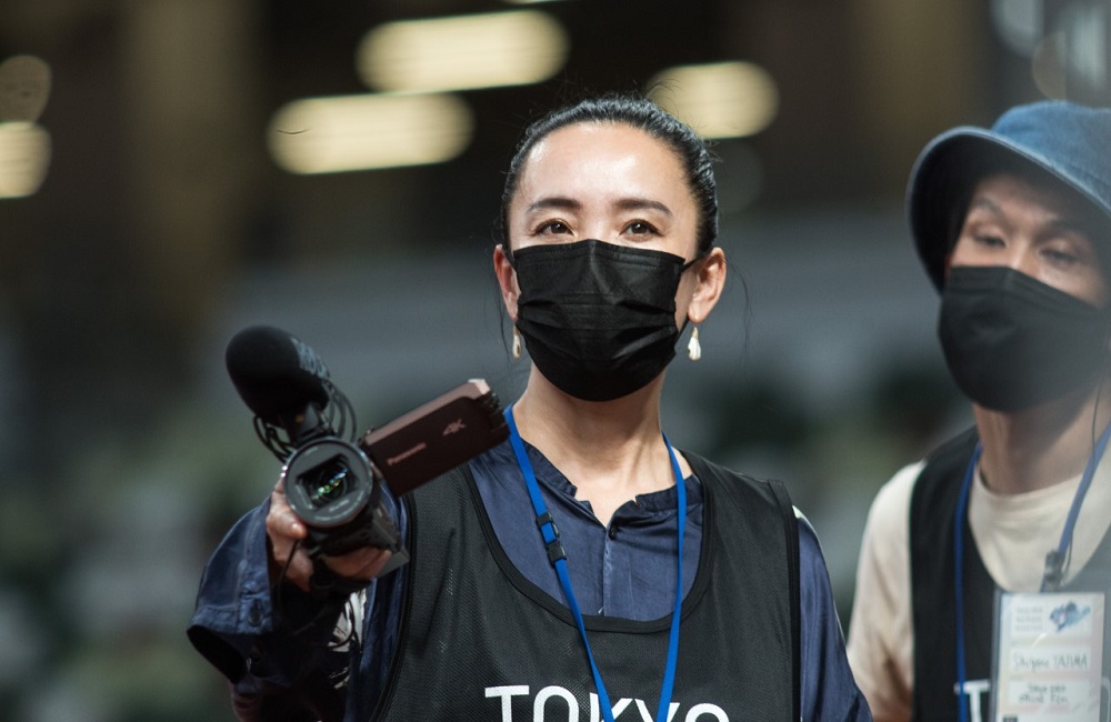 Archive photos taken on May 9, 2021 of Film Director Naomi Kawase and an assistant attend a test event at Tokyo’s National Stadium prior to the Olympics Games. (ANJ)