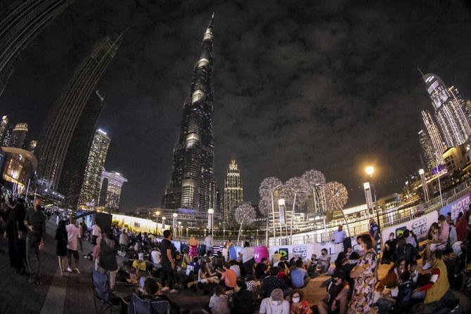 This picture taken with a fisheye lens shows people awaiting the New Year's Eve fireworks show below Burj Khalifa in Dubai. (AFP)