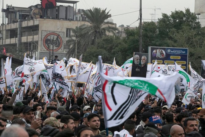 Members and supporters of Iraq’s Al-Hashed Al-Shaabi ex-paramilitary alliance took part in the demonstration and a symbolic funeral for slain top Iranian commander Qasem Soleimani. (Sabah Arar/AFP)