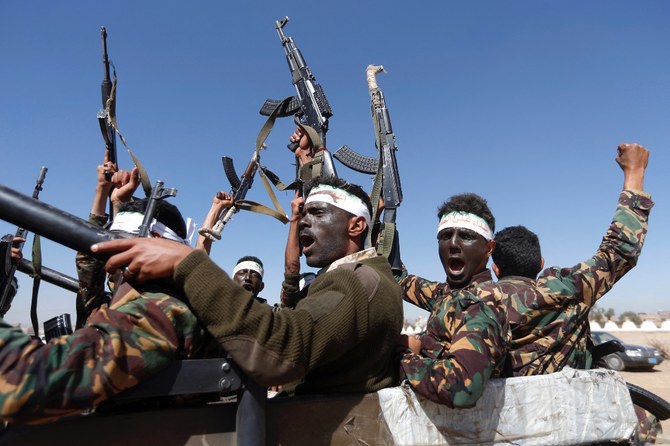 Newly recruited Houthi fighters chant slogans as they ride a military vehicle during a gathering in the capital Sanaa to mobilize more fighters to battlefronts to fight pro-government forces. (File/AFP)