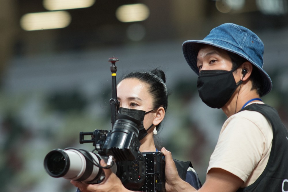 Archive photos taken on May 9, 2021 of Film Director Naomi Kawase and an assistant attend a test event at Tokyo’s National Stadium prior to the Olympics Games. (ANJ)