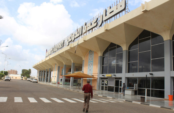 A man walks to the airport building in Yemen's southern city of Aden on January 3, 2021. (AFP)