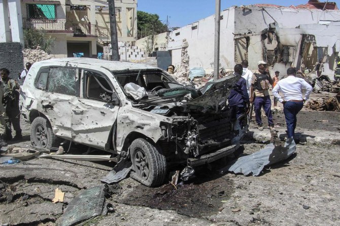 A general view of the scene of a car-bomb explosion in Mogadishu on January 12, 2022 where at least six people were killed and several others wounded in the huge blast that caused devastation in the area along the 21st October road. (AFP)