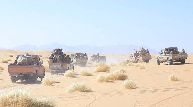 Yemeni government army soldiers ride on the back of pick-up trucks at the frontline of fighting against Houthis in Marib, Yemen. (File/Reuters)