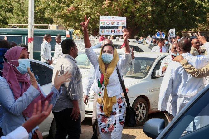 Dozens of Sudanese doctors demonstrate in Khartoum on January 16, 2022 to denounce attacks by security forces against medical personnel and doctors during pro-democracy rallies opposed to the October military coup. (AFP)