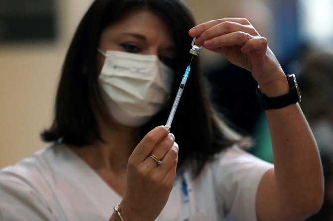 A medical worker prepares a coronavirus disease (COVID-19) vaccine as Israel kicks off a coronavirus vaccination drive, at Tel Aviv Sourasky Medical Center (Ichilov Hospital) in Tel Aviv, Israel December 20, 2020. (Reuters)