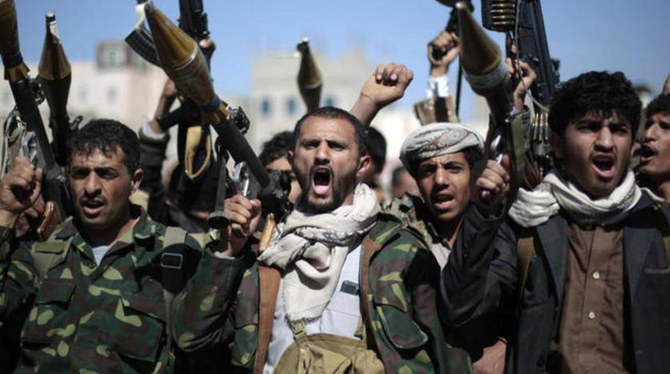 Houthi terrorists menacingly display their weapons during a gathering in Sanaa, Yemen's capital. (AFP file photo)