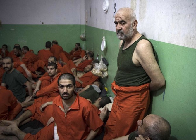 Detainees suspected of being affiliated with Daesh, Ghwayran prison, Al-Hasakah, Oct. 26, 2019. (AFP)