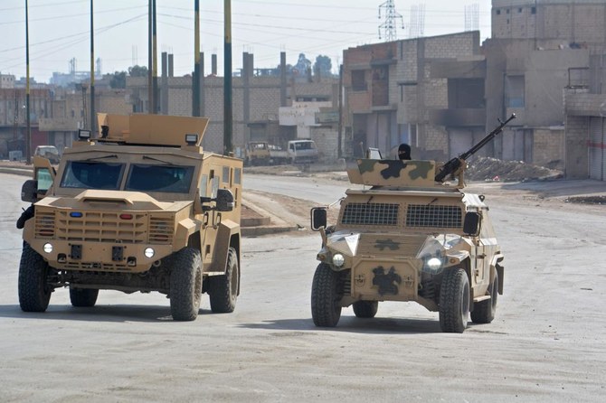 Syrian Democratic Forces (SDF) patrol a street in the northern Syrian city of Hasakeh on January 23, 2022. (AFP)