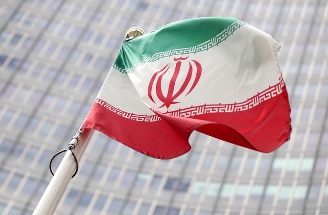 The Iranian flag flutters in front the International Atomic Energy Agency headquarters in Vienna, Austria. (File/Reuters)