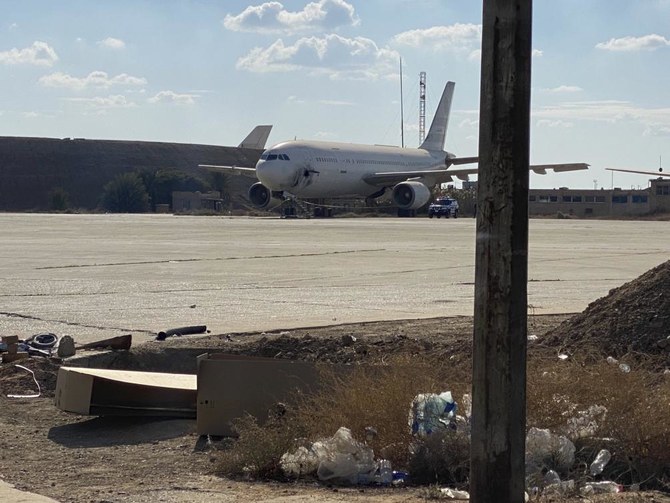 A damaged aircraft sits on the tarmac of Baghdad airport, after a rocket attack in Baghdad, Iraq, Friday, Jan. 28, 2022. (AP)