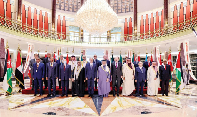 Kuwait’s Foreign Minister Sheikh Ahmad Nasser Al-Mohammad Al-Sabah poses with Arab foreign ministers as they meet to discuss Lebanon’s response to a Gulf proposal to mend a diplomatic rift. (Reuters)