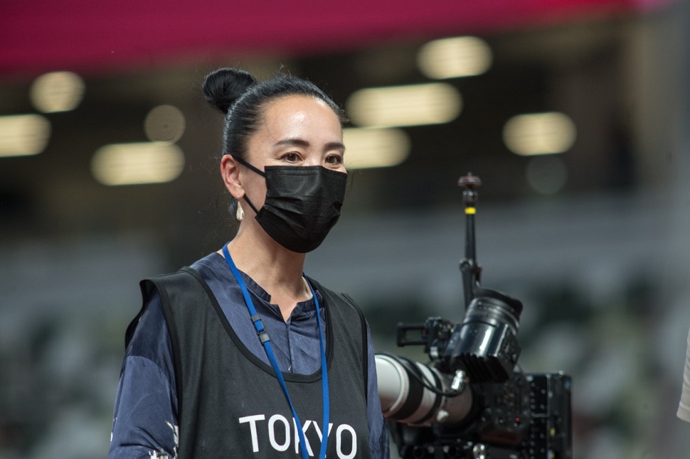 Archive photos taken on May 9, 2021 of Film Director Naomi Kawase and an assistant attend a test event at Tokyo’s National Stadium prior to the Olympics Games. (ANJ)