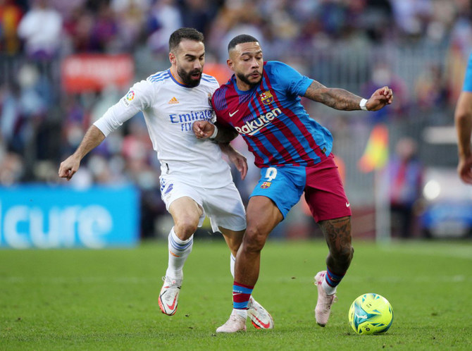 Barcelona's Memphis Depay in action with Real Madrid's Dani Carvajal. (Reuters/File)
