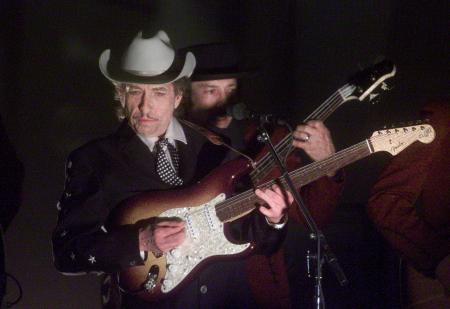 In this file photo taken on February 26, 2002: US singer Bob Dylan (front) performs at the 44th Annual Grammy Awards in Los Angeles, California. The US music legend sold his entire recording catalogue along with the rights to future releases to Sony according to a statement released on January 24, 2022 by Sony. (AFP)