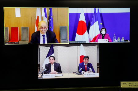 A screen shows Japan's Foreign Minister Yoshimasa Hayashi and Defence Minister Nobuo Kishi and their French counterparts Jean-Yves Le Drian and Florence Parly attend a video conference at the Foreign Ministry in Tokyo, Japan, January 20, 2022. (Reuters)
