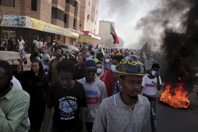People chant slogans during a protest to denounce the October 2021 military coup, in Khartoum, Sudan on Thursday. (AP)