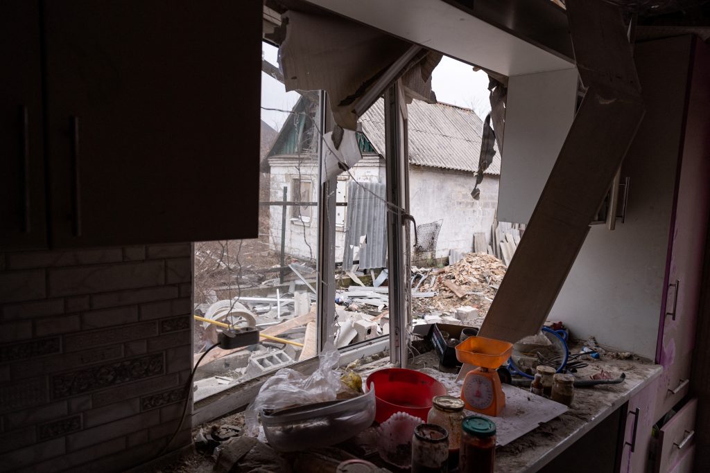A view of a private house damaged by recent shelling in the settlement of Trudovskiye outside Donetsk on February 26, 2022. The settlement is located around 700 meters off the contact line with Ukrainian troops. (AFP)