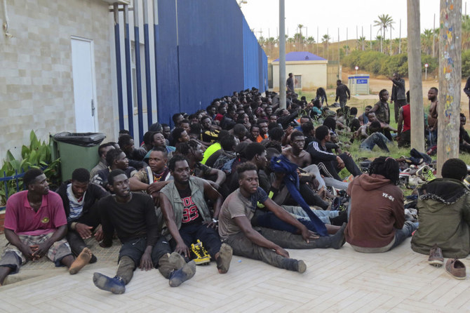 File photo of migrants in Melilla, Spain. Activists said Tuesday Moroccan navy rescued 63 migrants including 15 women and 3 children after their vessel started to sink while trying to reach the Canary Islands. (AP)