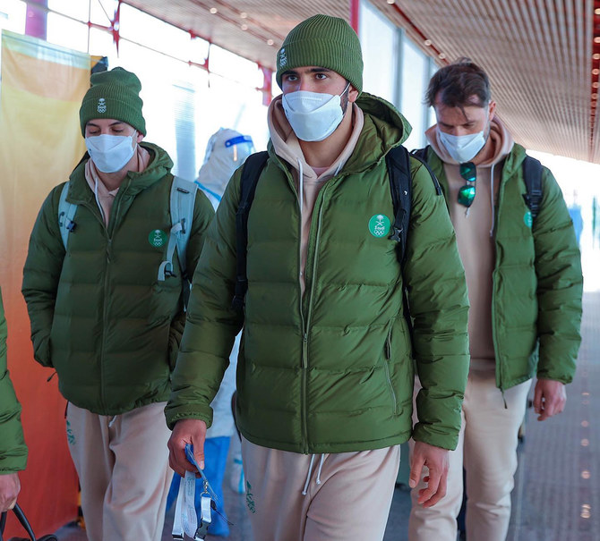 Saudi professional skier Fayik Abdi, center, reached the Chinese capital on Thursday in preparation for his historic participation at the 2022 Beijing Winter Olympics, starting Feb. 4. (Supplied)