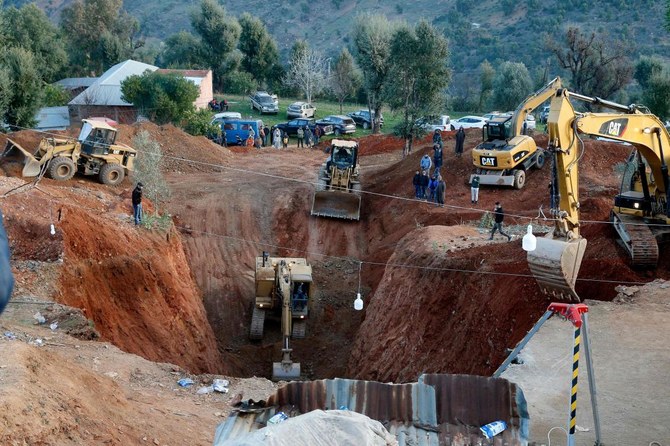 Moroccan authorities and firefighters work to get five-year-old child Rayan out of a well into which he fell after 48 hours earlier, on Thursday in the region of Chefchaouen near the city of Bab Berred. (AFP)