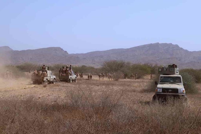 Yemeni pro-government fighters man a position near al-Muhsam camp during fighting to drive the pro-Iran Houthi rebels from the area of Harad, in Yemen's Hajjah province on February 4, 2022. (AFP)