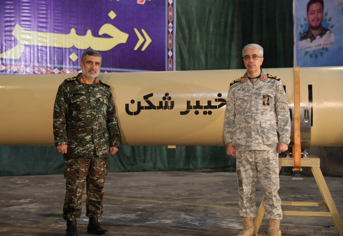 This photo release on Feb. 9, 2022, shows Iran's military chief Mohammad Bagheri and IRGC Aerospace Force Commander Amir Ali Hajizadeh unveiling the 