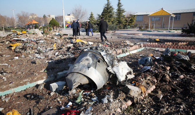 Rescue teams work amid debris of a Ukrainian plane shot down by Iranian security forces in Tehran early on January 8, 2020, killing everyone on board. (AFP file)
