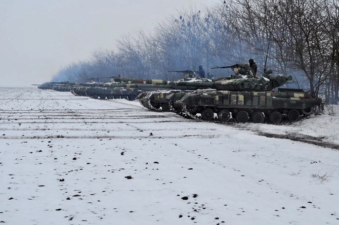 This handout picture taken and released by press-service of General Staff of the Armed Forces of Ukraine on February 8, 2022 shows tanks of the Ukrainian Military forces taking part in a drill in Dnipropetrovsk region. (AFP)