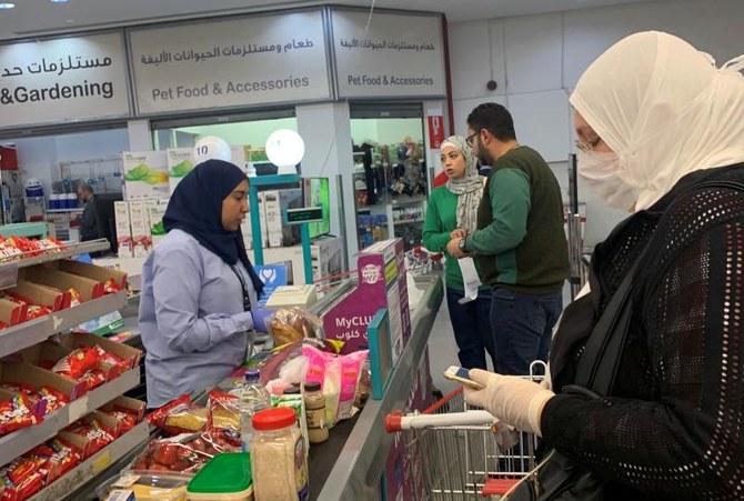 Woman wears a face mask while shopping at Carrefour in Egypt. (Reuters)