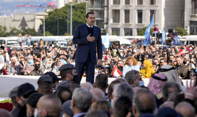Former Lebanese Prime Minister Saad Hariri gestures to his supporters after he paid his respects at the grave of his father, former Prime Minister Rafik Hariri, on the 17th anniversary of his assassination in Beirut, Lebanon, Monday, Feb. 14, 2022. (AP)